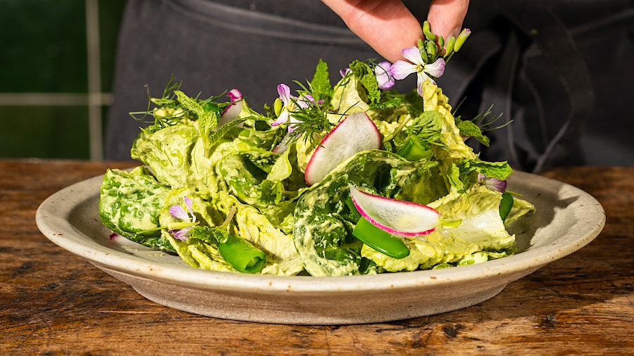 Chef Bryan Oliver's spring salad is packed with fresh herbs and topped with delicate blossoms.